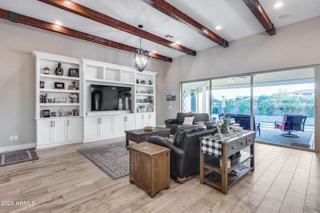 living room featuring light hardwood / wood-style flooring, beam ceiling, and a notable chandelier