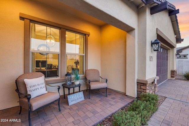 patio terrace at dusk with a garage