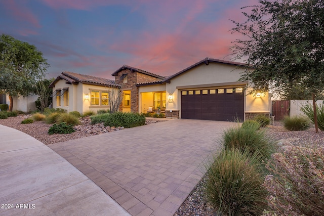 mediterranean / spanish house featuring a garage