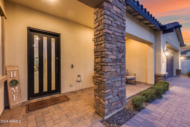 exterior entry at dusk with french doors