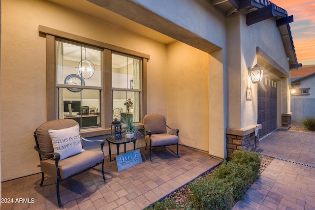 patio terrace at dusk with a garage