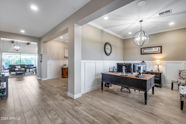 office featuring light wood-type flooring, ornamental molding, and a chandelier