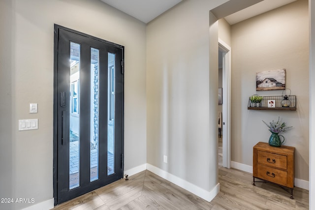 foyer with light hardwood / wood-style floors and a wealth of natural light