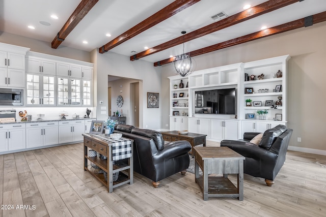 living room featuring a notable chandelier, light wood-type flooring, and beam ceiling