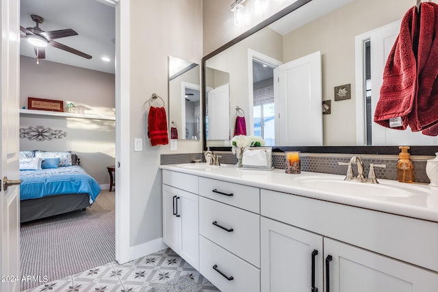 bathroom with ceiling fan and vanity