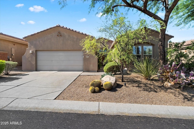 7291 E Eagle Feather Rd, Scottsdale, AZ 85266 - view of front of house featuring stucco siding, a garage, concrete driveway, and a tiled roof