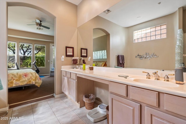 7291 E Eagle Feather Rd, Scottsdale, AZ 85266 - ensuite bathroom with a ceiling fan, double vanity, tile patterned floors, and baseboards
