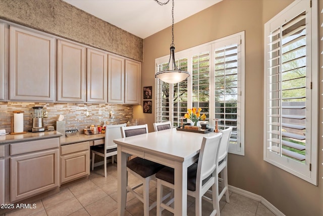 7291 E Eagle Feather Rd, Scottsdale, AZ 85266 - dining room with light tile patterned flooring and baseboards