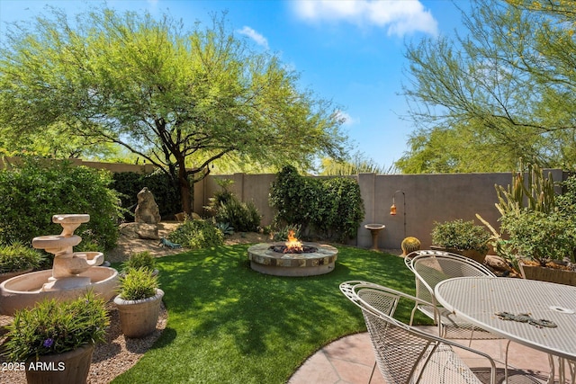 7291 E Eagle Feather Rd, Scottsdale, AZ 85266 - view of yard with an outdoor fire pit and a patio area