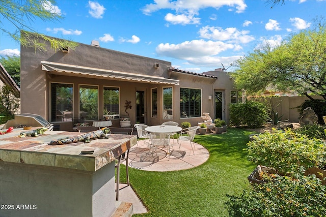 7291 E Eagle Feather Rd, Scottsdale, AZ 85266 - back of house with a patio and stucco siding