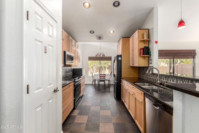 kitchen featuring recessed lighting, a sink, appliances with stainless steel finishes, light brown cabinetry, and tasteful backsplash