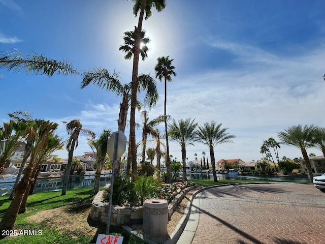 view of street featuring traffic signs and curbs