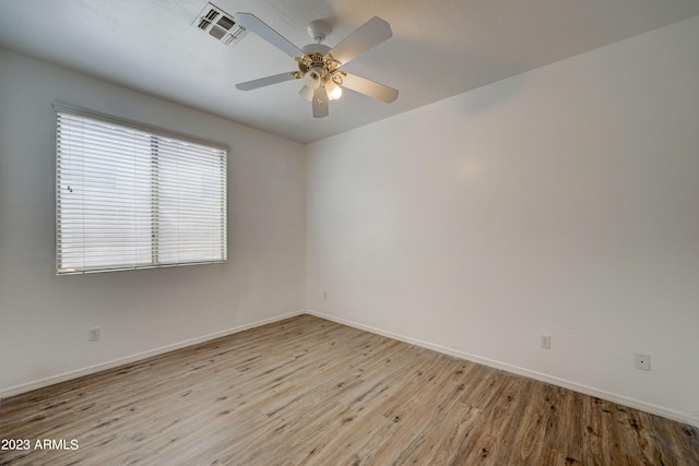 unfurnished room featuring ceiling fan and light wood-type flooring