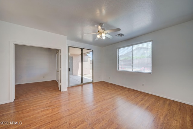 unfurnished bedroom featuring ceiling fan and light wood-type flooring