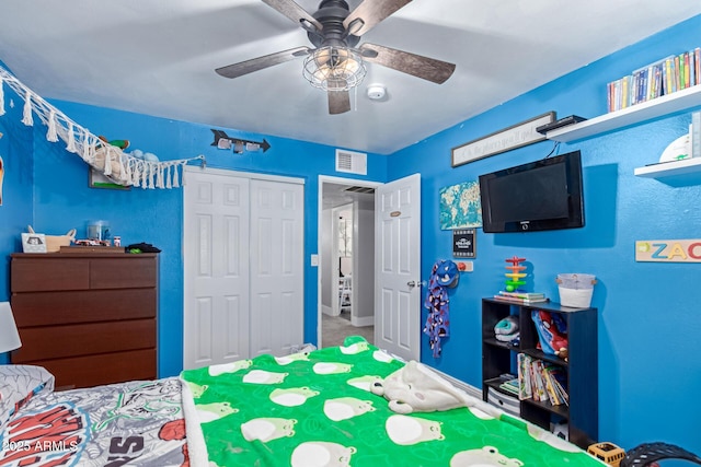 bedroom with visible vents, a closet, and a ceiling fan