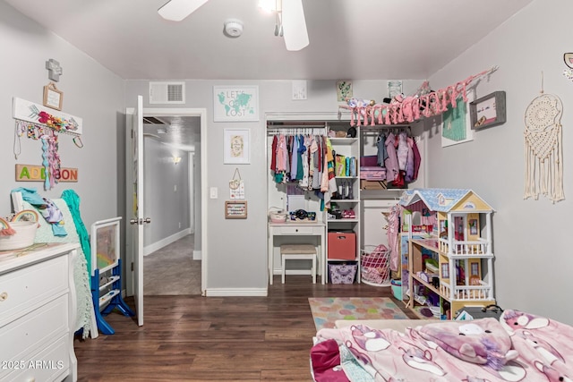 bedroom with visible vents, ceiling fan, and wood finished floors