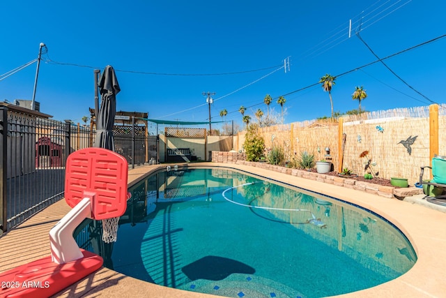 view of swimming pool featuring a fenced backyard and a fenced in pool