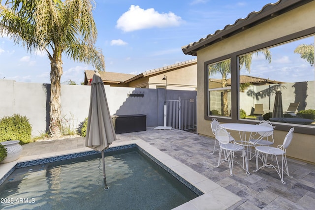 view of pool featuring fence and a patio area