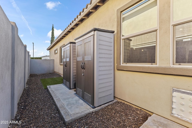 view of outdoor structure with a fenced backyard