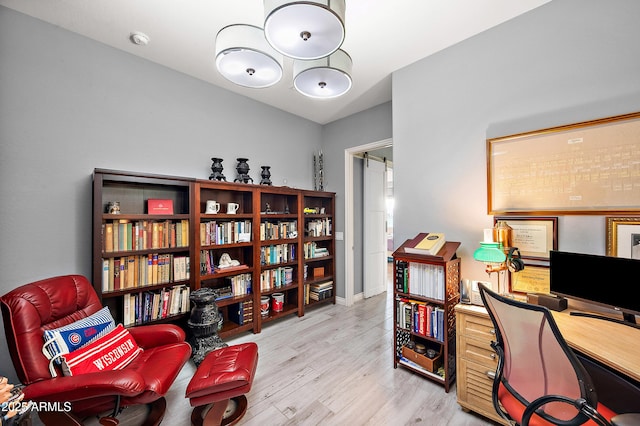 home office with light wood-style floors