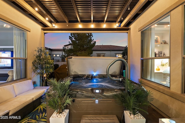 patio terrace at dusk featuring an outdoor hangout area