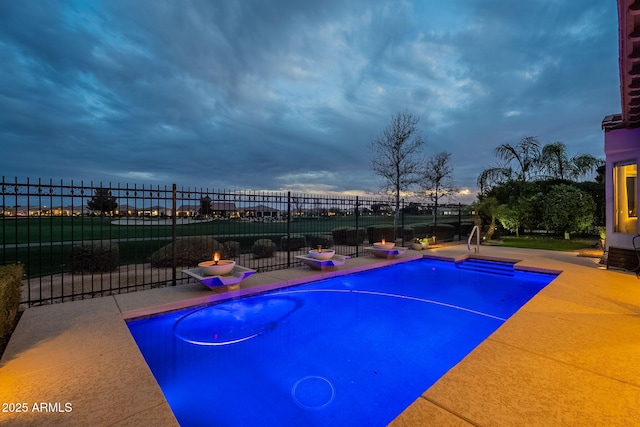 view of pool with a patio, fence, and a fenced in pool