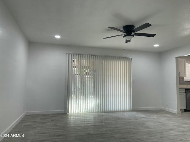 spare room featuring ceiling fan and light wood-type flooring