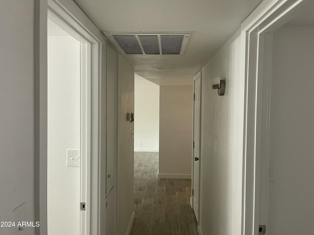 hall with dark hardwood / wood-style floors