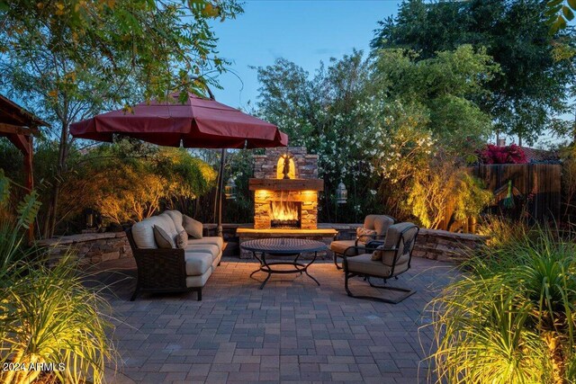 view of patio / terrace featuring an outdoor living space with a fireplace