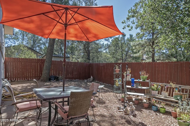 view of patio / terrace with a fenced backyard and outdoor dining space