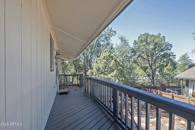wooden deck featuring fence