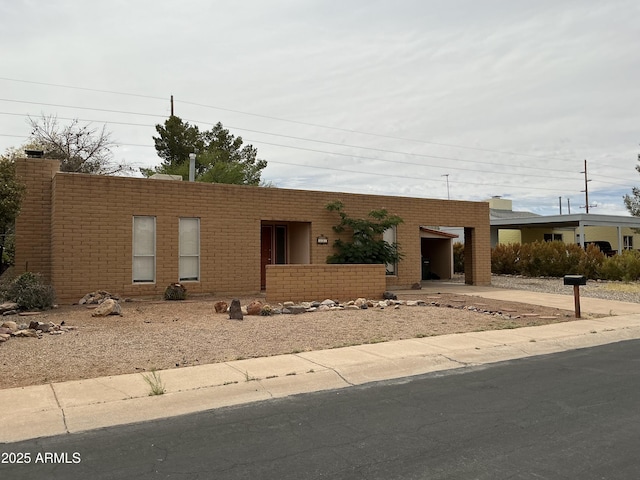 831 S Calle Virada, Sierra Vista, AZ 85635 - view of front of home with concrete driveway, brick siding, and a carport