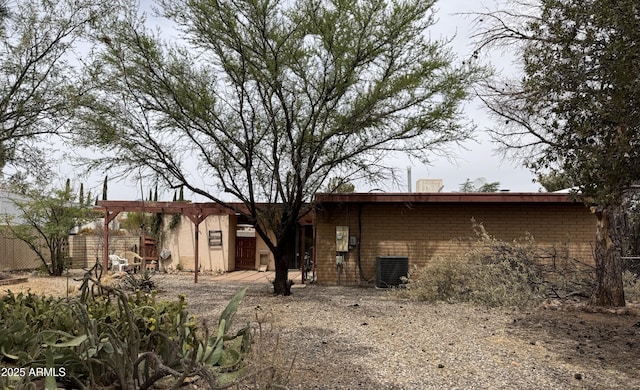 831 S Calle Virada, Sierra Vista, AZ 85635 - rear view of property featuring cooling unit and brick siding