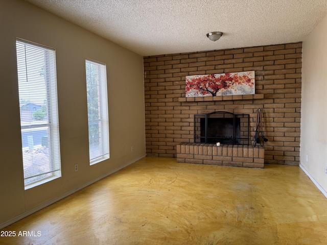 831 S Calle Virada, Sierra Vista, AZ 85635 - unfurnished living room featuring a brick fireplace, a textured ceiling, baseboards, and concrete floors