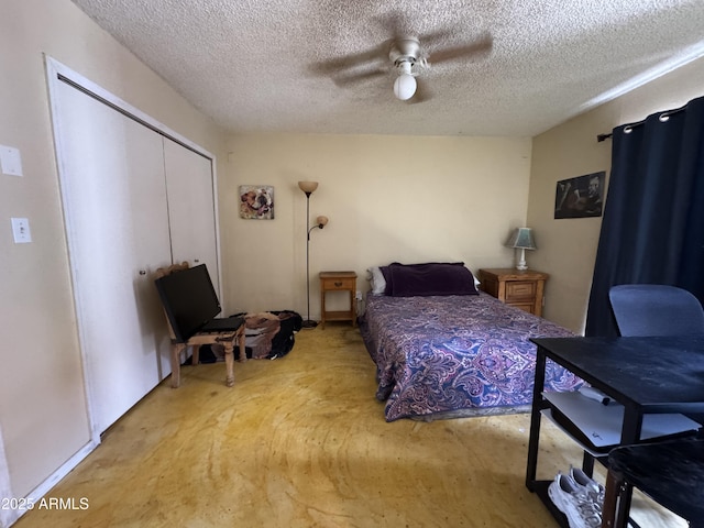 831 S Calle Virada, Sierra Vista, AZ 85635 - bedroom with concrete flooring, a closet, ceiling fan, and a textured ceiling