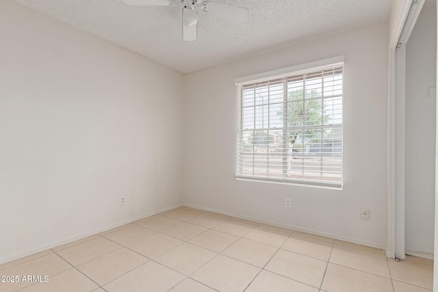 702 W Sequoia Dr, Phoenix, AZ 85027 - unfurnished room with a textured ceiling, a ceiling fan, and light tile patterned floors