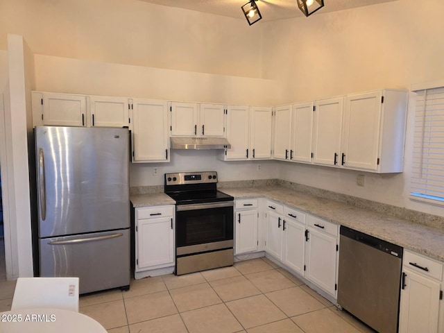 702 W Sequoia Dr, Phoenix, AZ 85027 - kitchen featuring stainless steel appliances, under cabinet range hood, light tile patterned flooring, white cabinetry, and light stone countertops