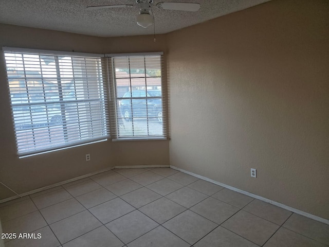 702 W Sequoia Dr, Phoenix, AZ 85027 - unfurnished room featuring ceiling fan, light tile patterned flooring, and a textured ceiling