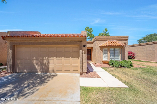 view of front of house featuring a tile roof, a garage, a front lawn, concrete driveway, and stucco siding