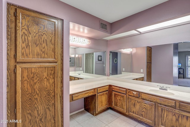 bathroom featuring vanity, tile patterned flooring, and visible vents