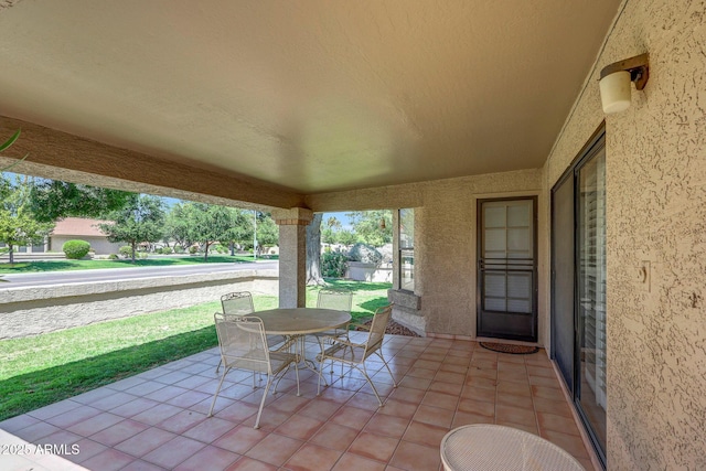 view of patio featuring outdoor dining area