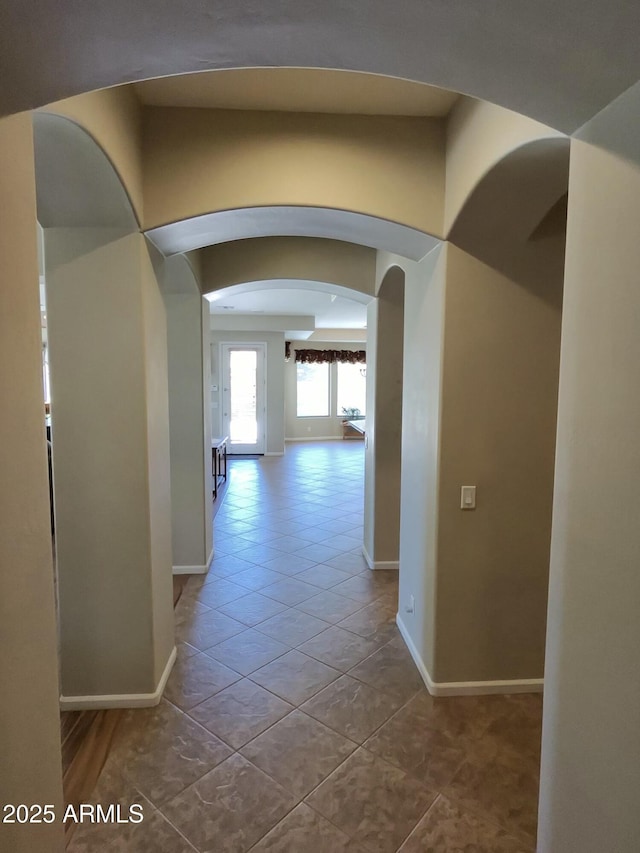 3225 E Cardinal Ct, Chandler, AZ 85286 - hall with arched walkways and tile patterned floors