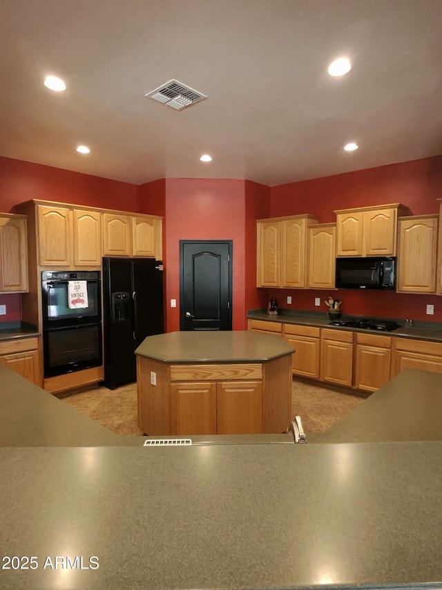 3225 E Cardinal Ct, Chandler, AZ 85286 - kitchen with black appliances, a kitchen island, light brown cabinets, and recessed lighting