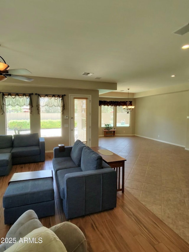 3225 E Cardinal Ct, Chandler, AZ 85286 - living area with a chandelier, a ceiling fan, wood finished floors, and recessed lighting