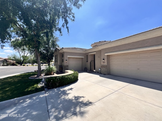 3225 E Cardinal Ct, Chandler, AZ 85286 - ranch-style house with stucco siding, a garage, driveway, and stone siding