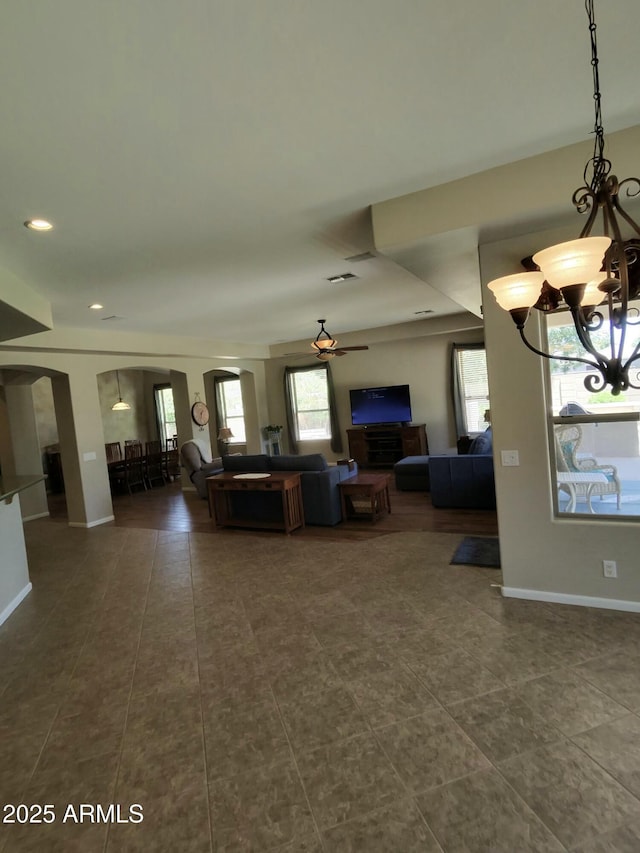 3225 E Cardinal Ct, Chandler, AZ 85286 - living room with a chandelier, dark tile patterned flooring, arched walkways, recessed lighting, and ceiling fan