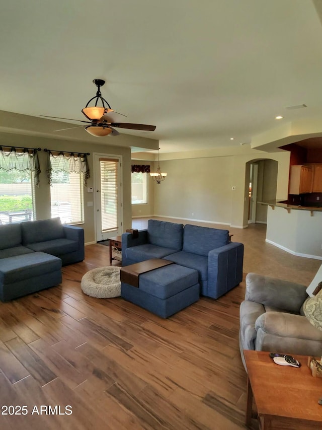 3225 E Cardinal Ct, Chandler, AZ 85286 - living area with wood finished floors, plenty of natural light, ceiling fan, arched walkways, and recessed lighting