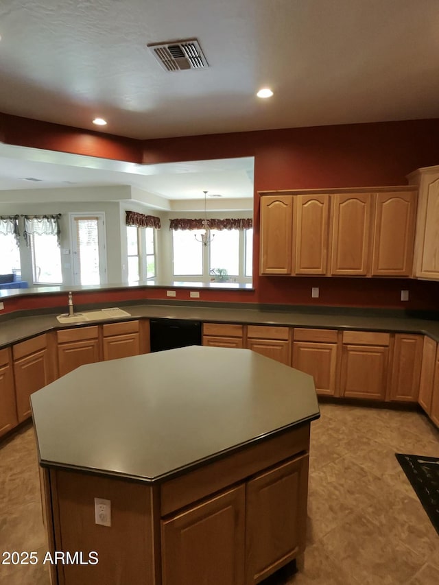 3225 E Cardinal Ct, Chandler, AZ 85286 - kitchen with black dishwasher, recessed lighting, a kitchen island, and light brown cabinetry