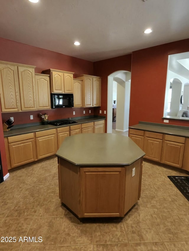 3225 E Cardinal Ct, Chandler, AZ 85286 - kitchen with black appliances, arched walkways, a kitchen island, light brown cabinets, and recessed lighting