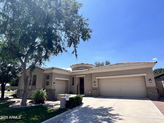 3225 E Cardinal Ct, Chandler, AZ 85286 - view of front of home with an attached garage, stone siding, driveway, stucco siding, and a tiled roof